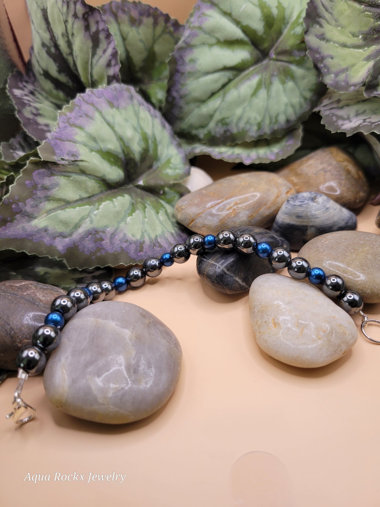 Silver and blue hematite bracelet with clasp.