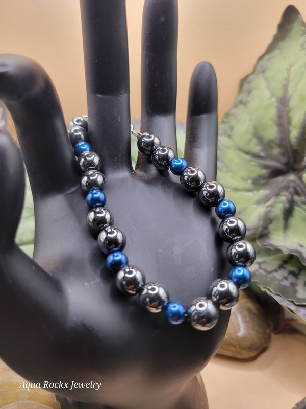 Silver and blue hematite bracelet with clasp.