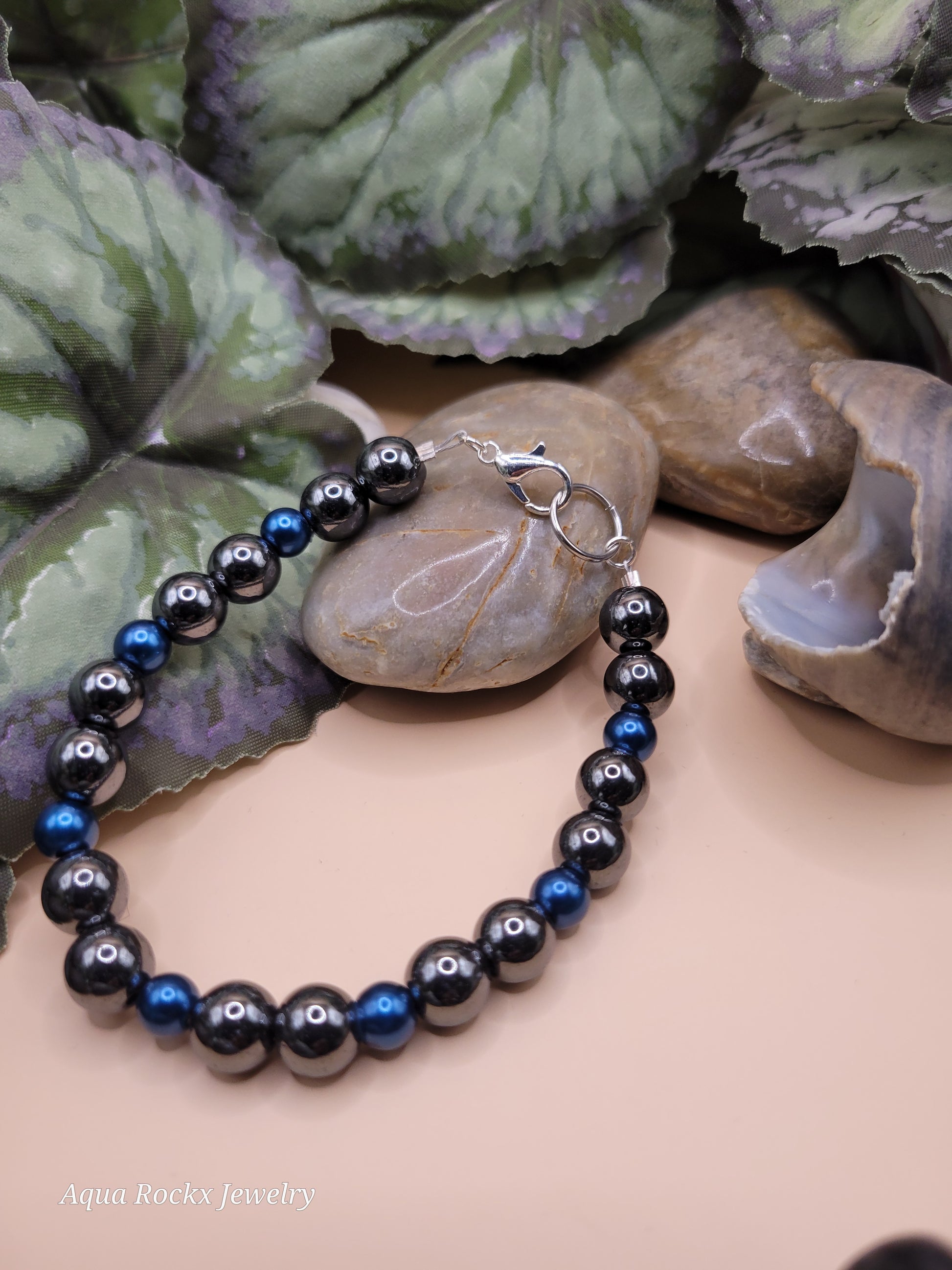 Silver and blue hematite bracelet with clasp.