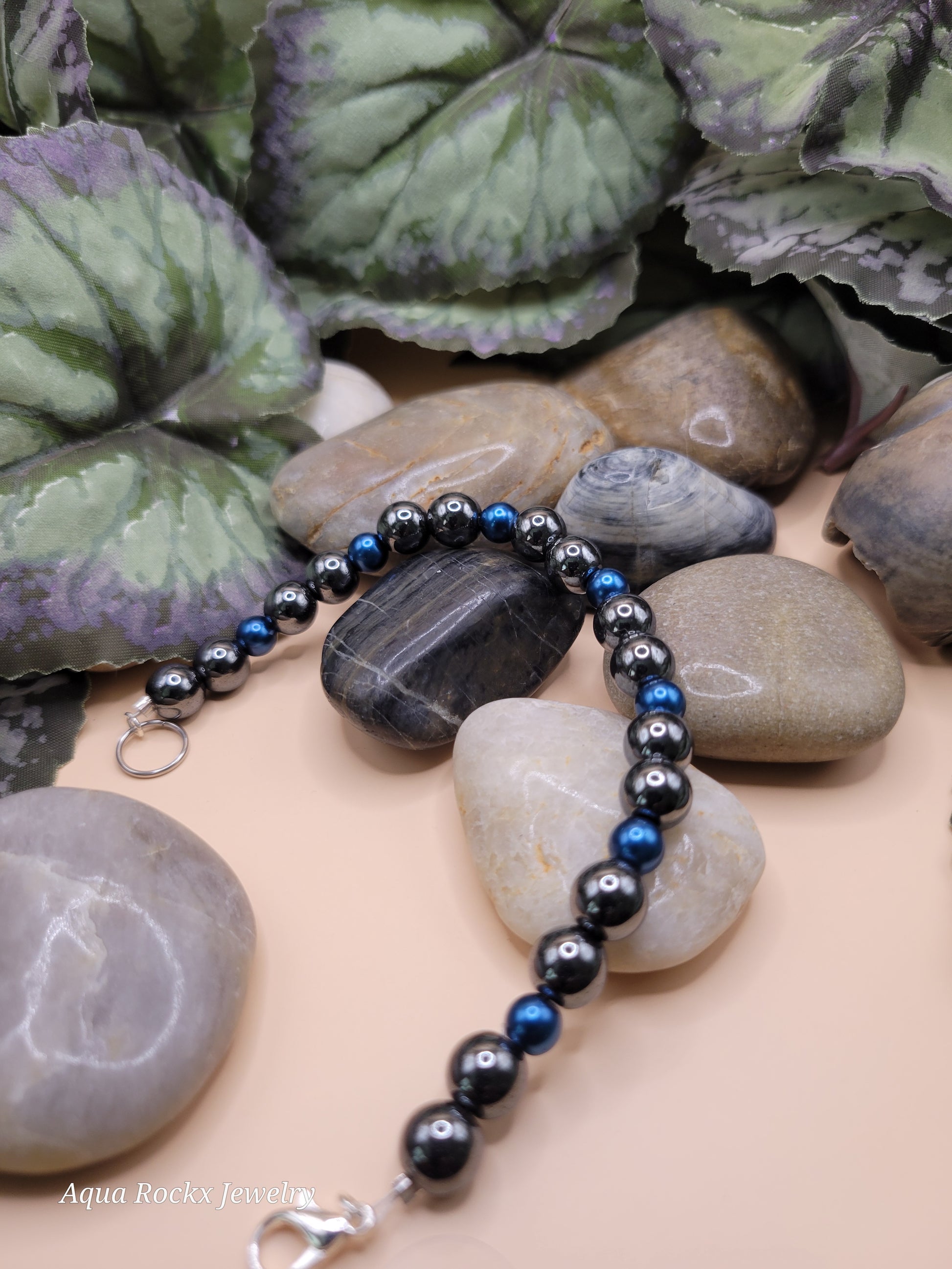 Silver and blue hematite bracelet with clasp.
