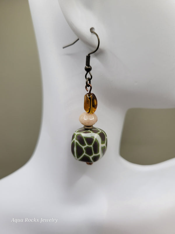 Close-up of a beaded earring with a white background