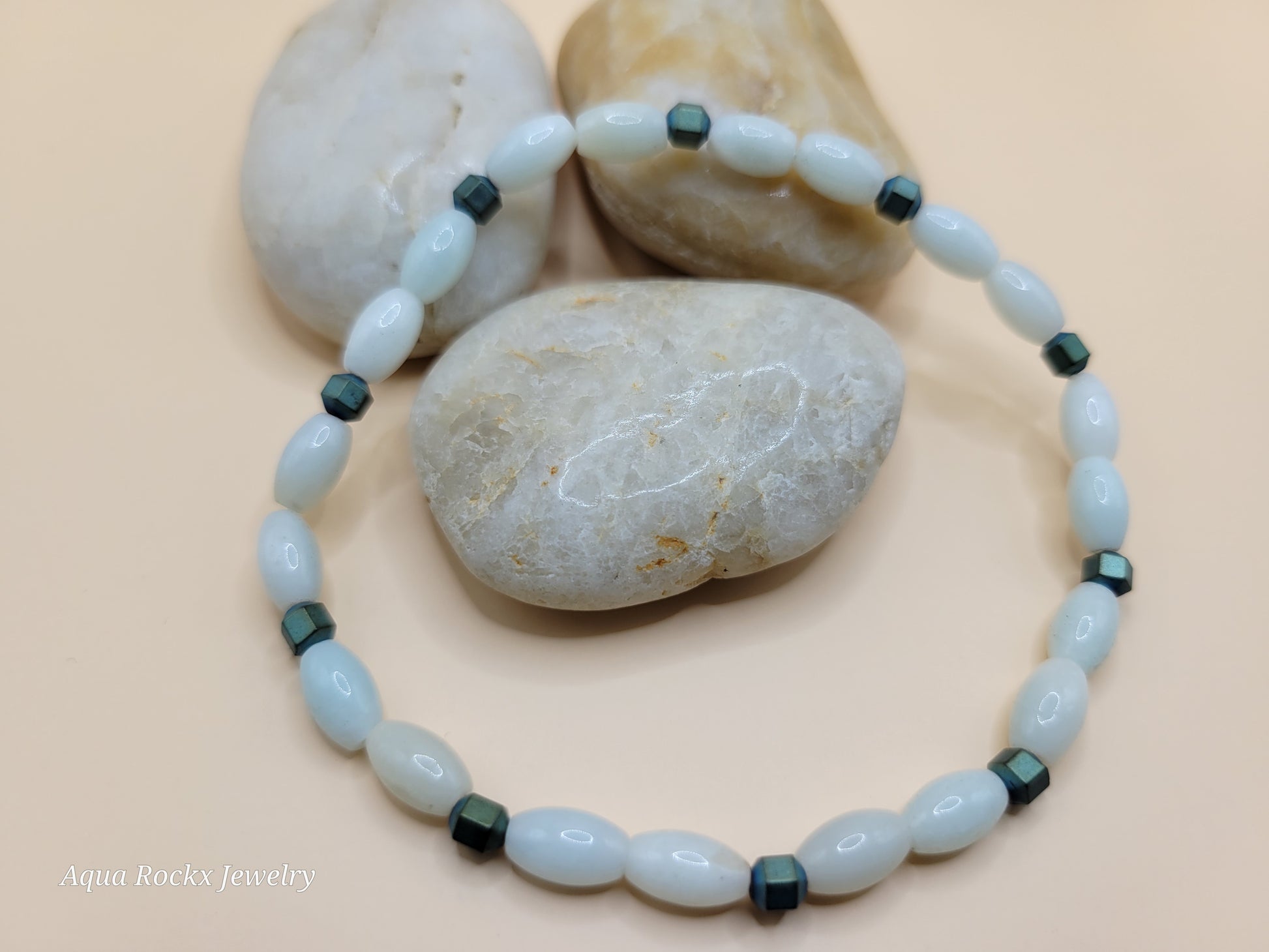 Beaded Jadeite bracelet  on a beige background