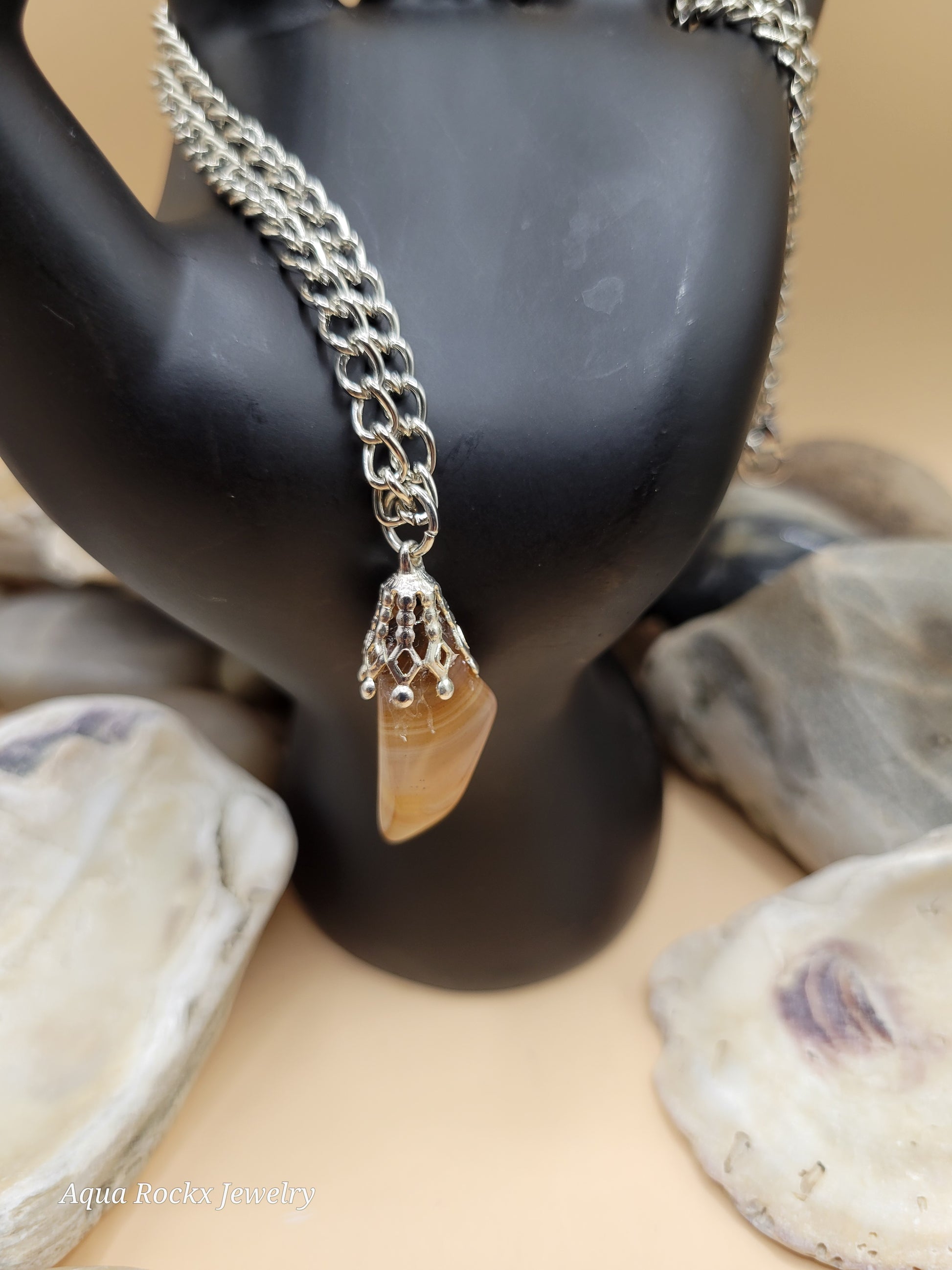 silver chain with orange quartz pendant