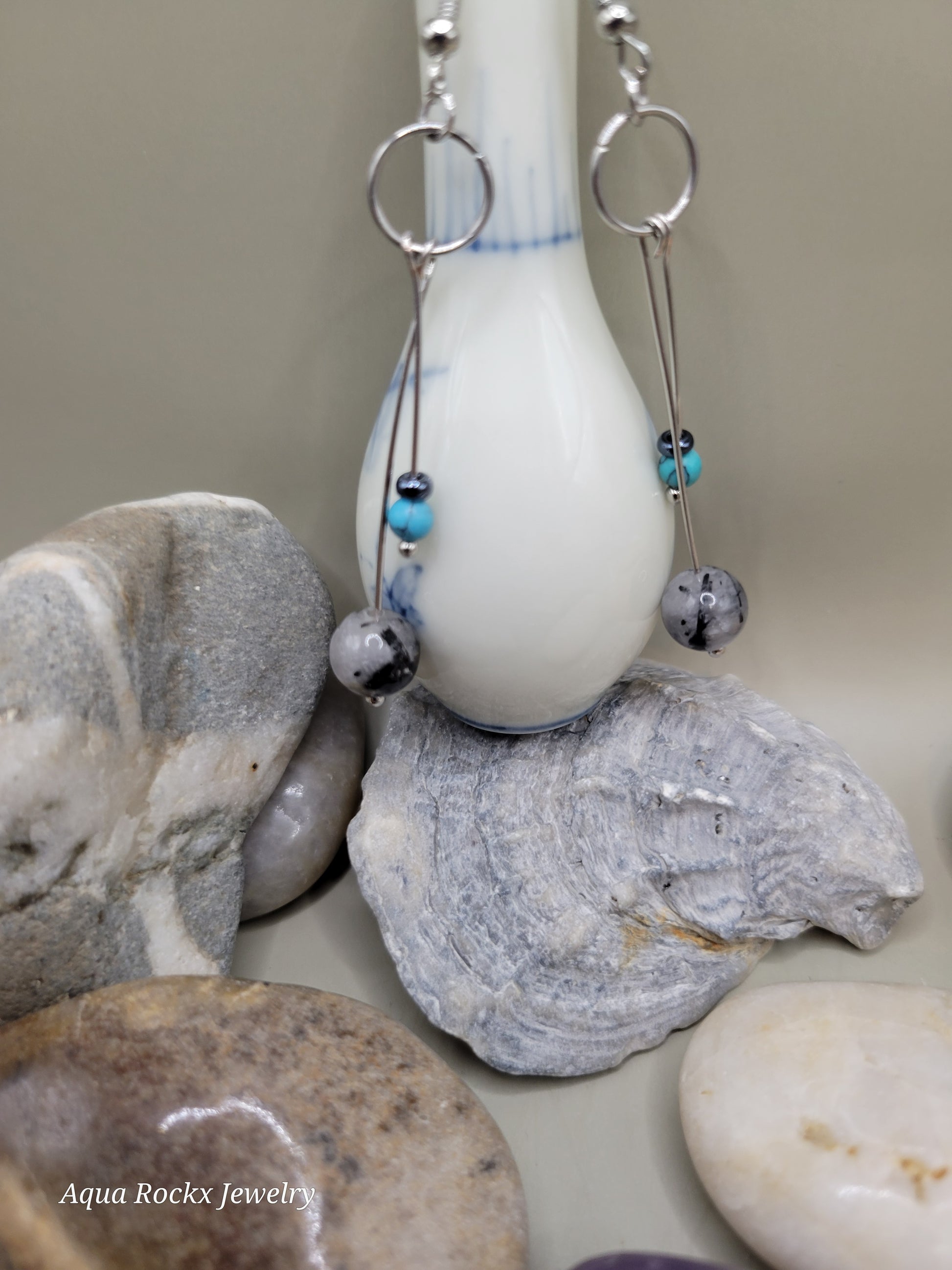 Close-up of a fishing lure with beads on a background of stones