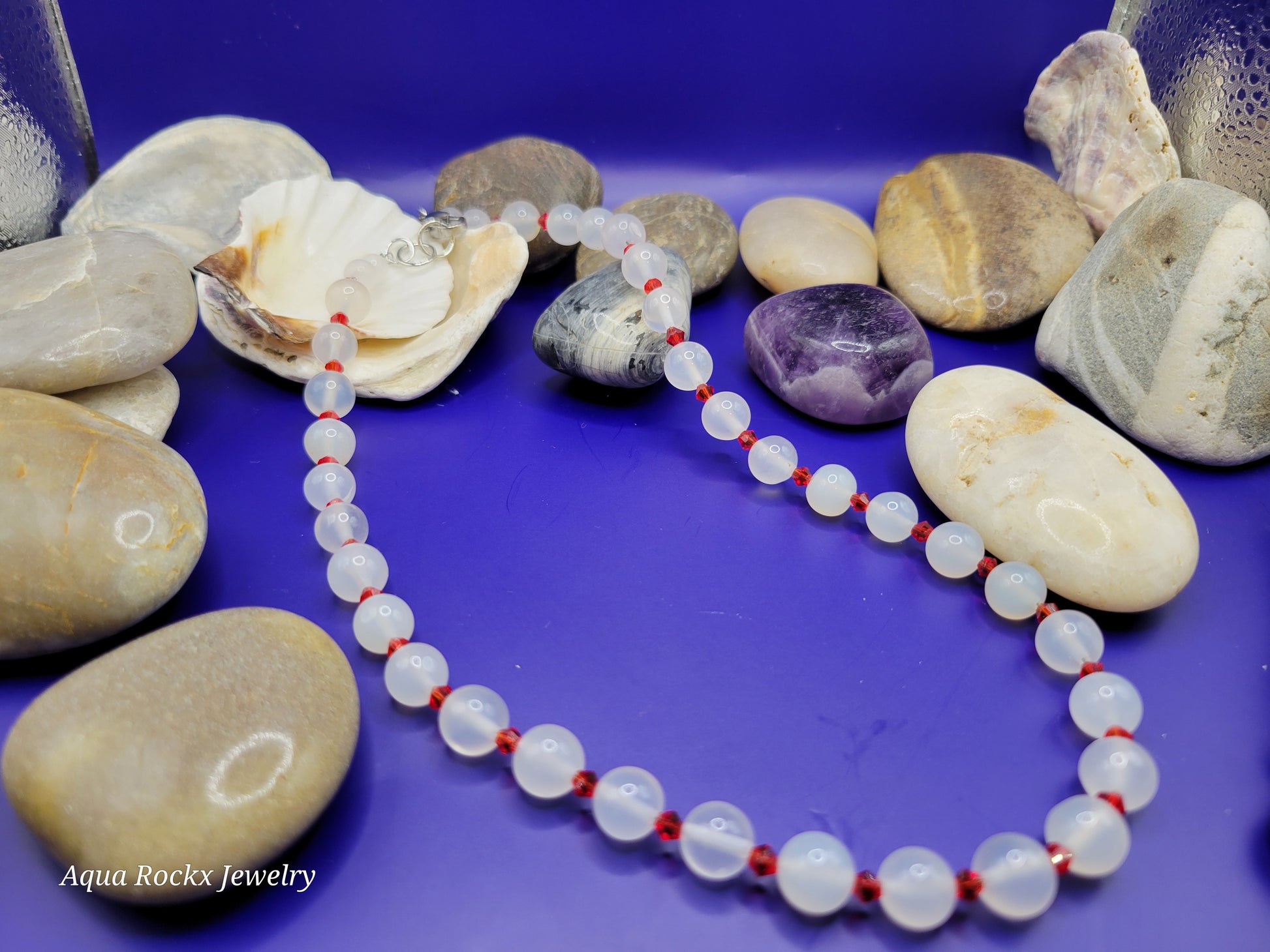 Necklace with white quartz and red accents.